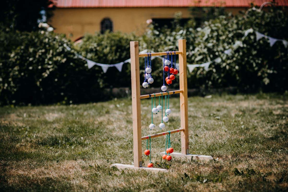 Balls rolling across a short grass lawn